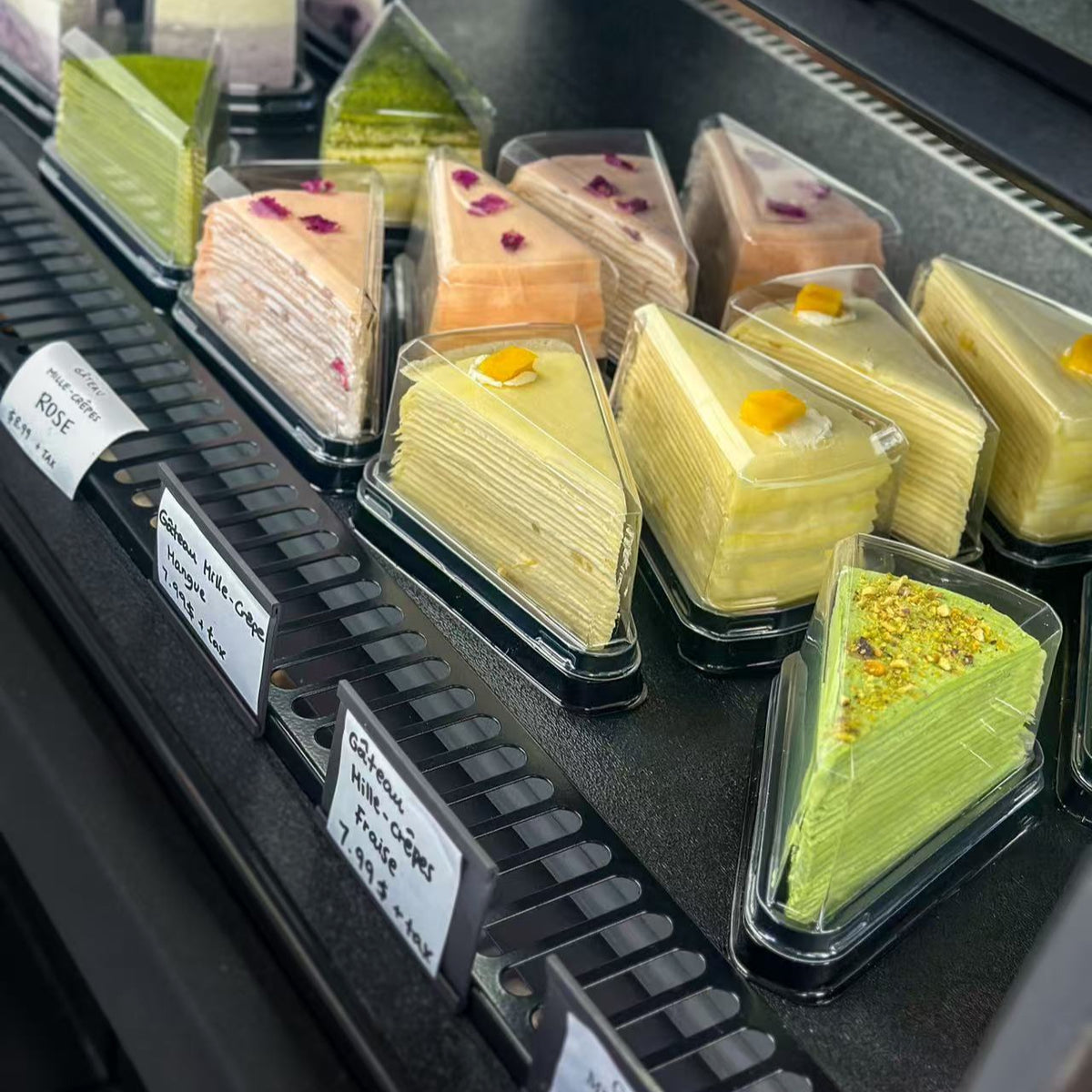 Mille crepe cake slices in a display case