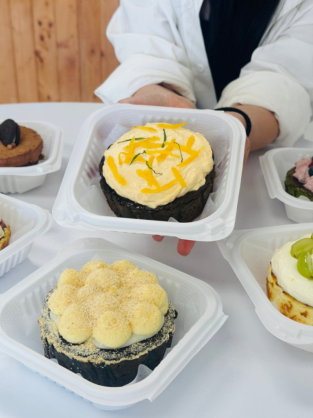 Fruit-topped Basque cheesecake in a serving box
