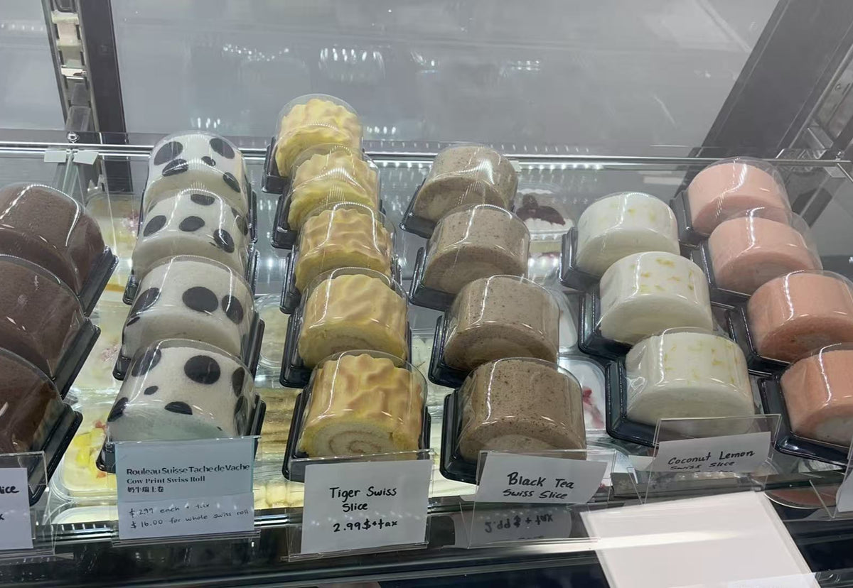 Swiss roll cakes displayed in a refrigerated case