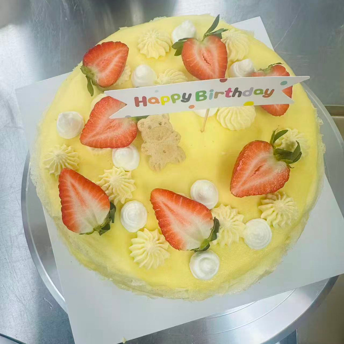 Mango mille crepe cake decorated with fruit