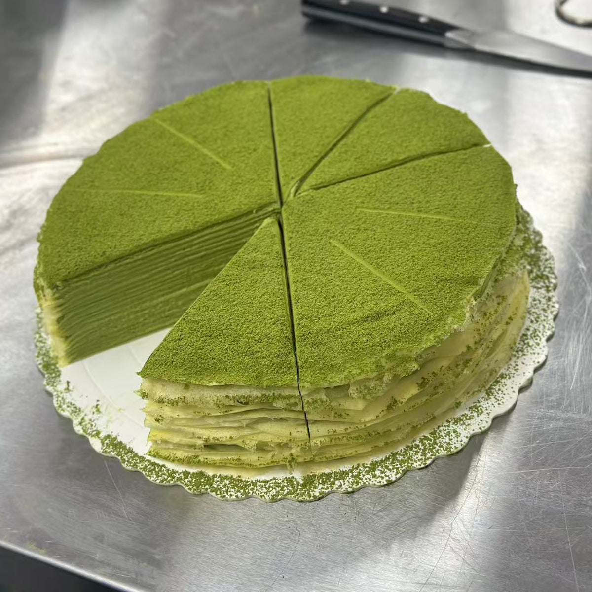 Matcha mille crepe cake cut into portions