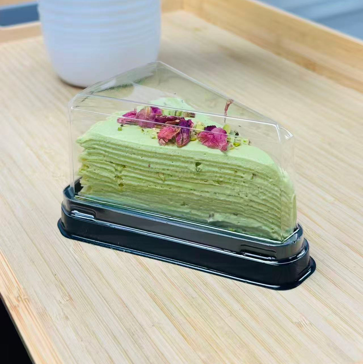 Pistachio mille crepe cake slice